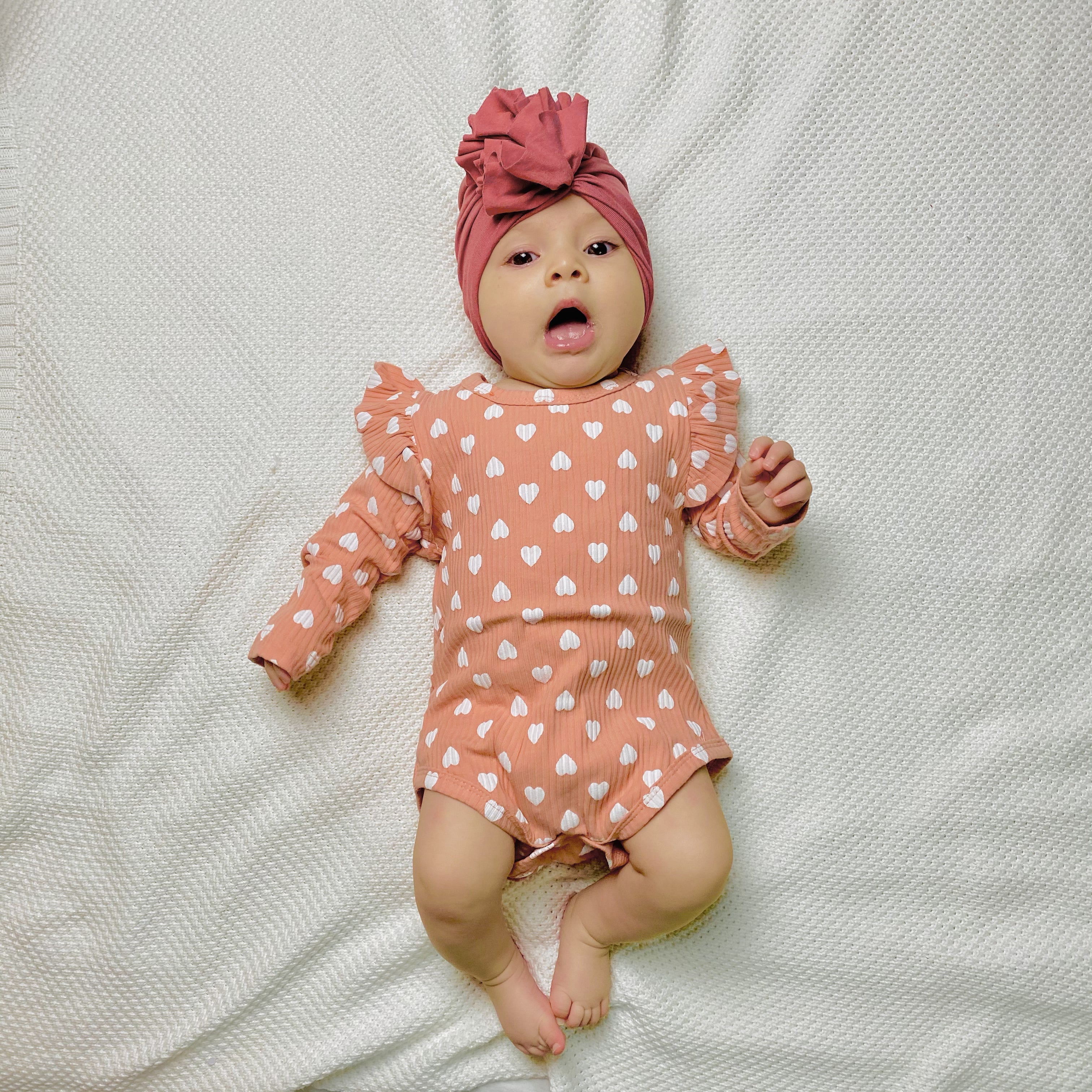 Body rosa salmone con cuoricini