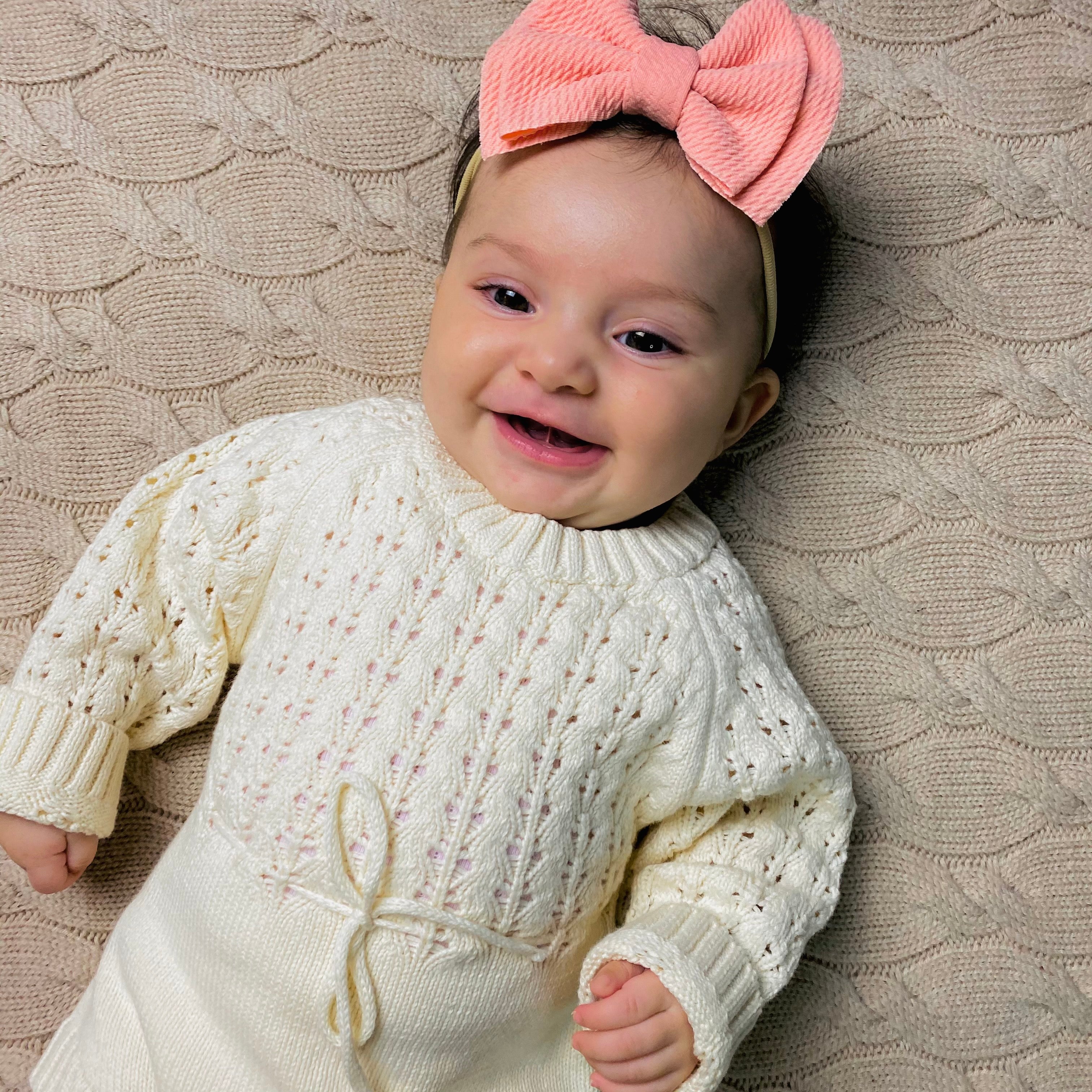 Pagliaccetto a maglia in bianco crema