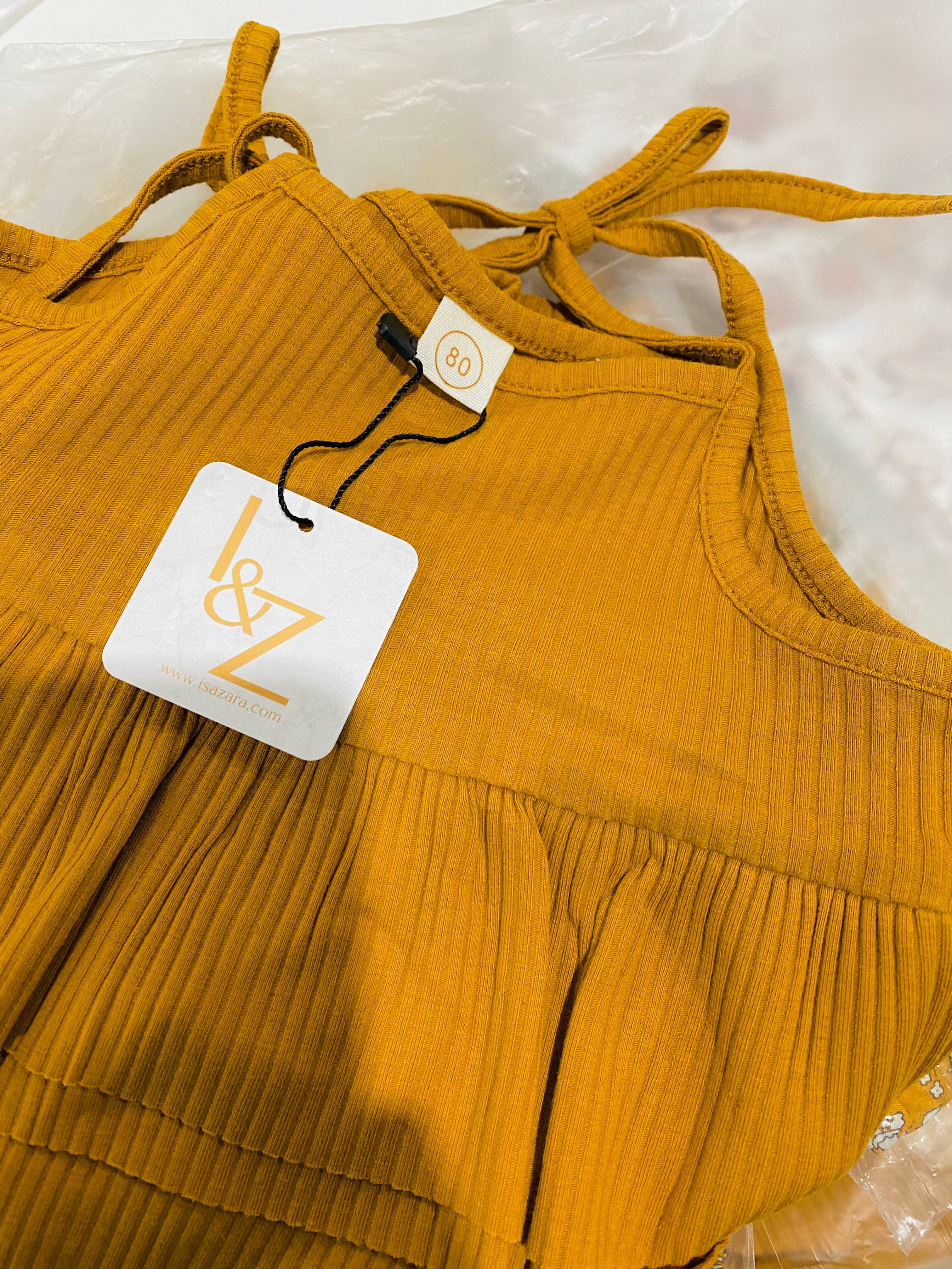 Tutina a costine con spalline regolabili