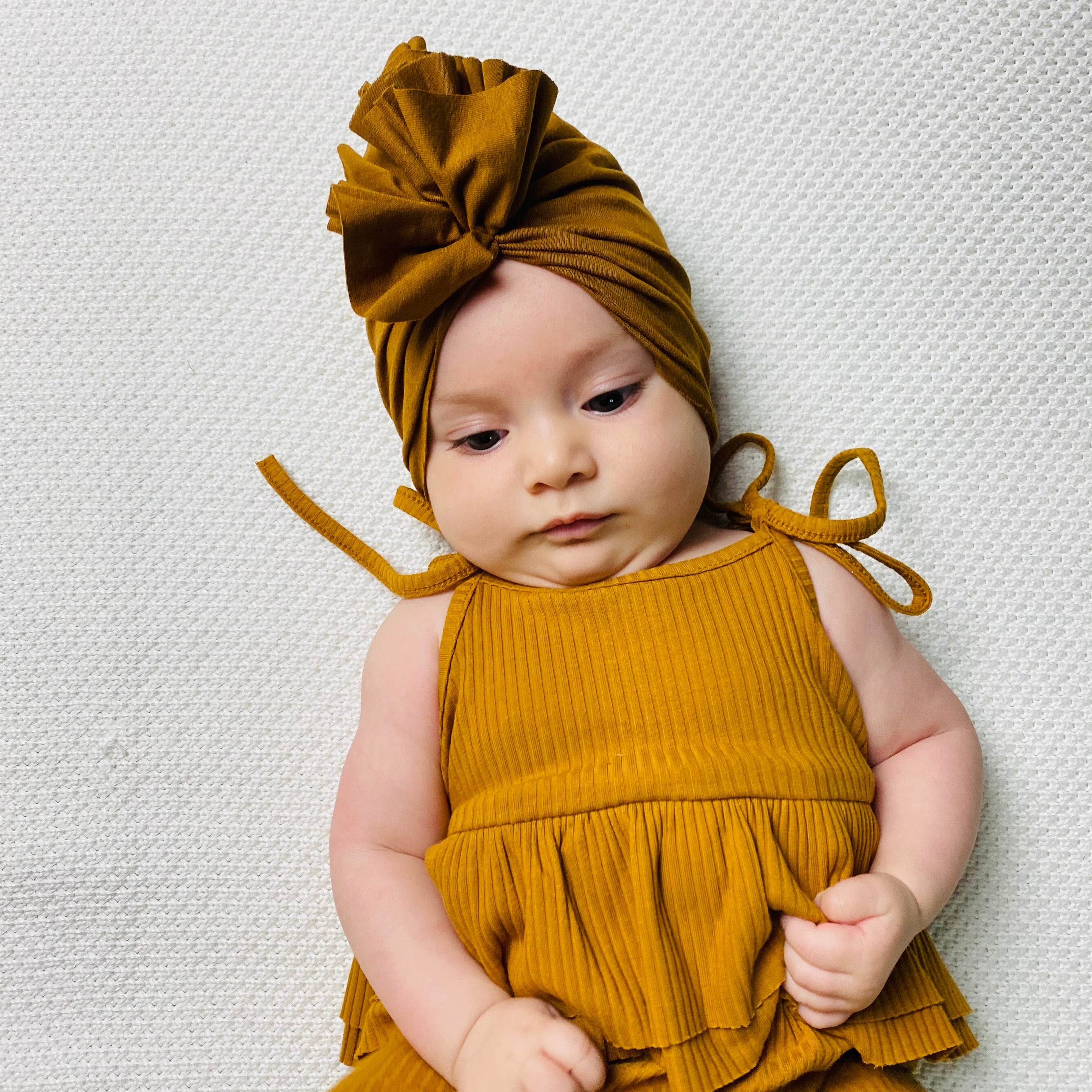 Tutina a costine con spalline regolabili