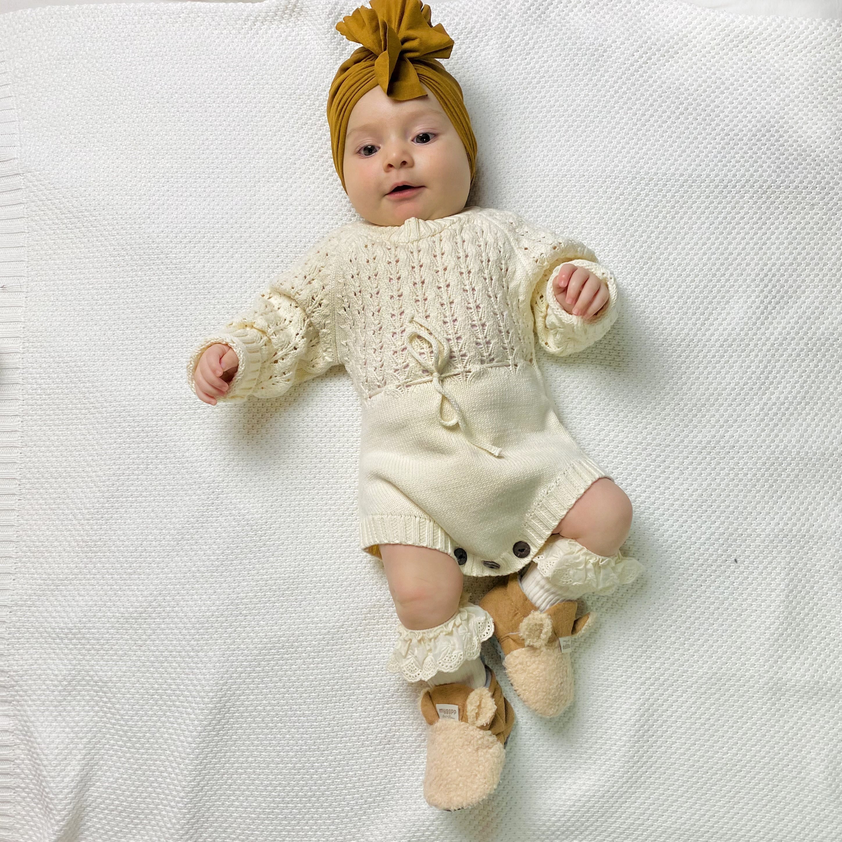 Pagliaccetto a maglia in bianco crema