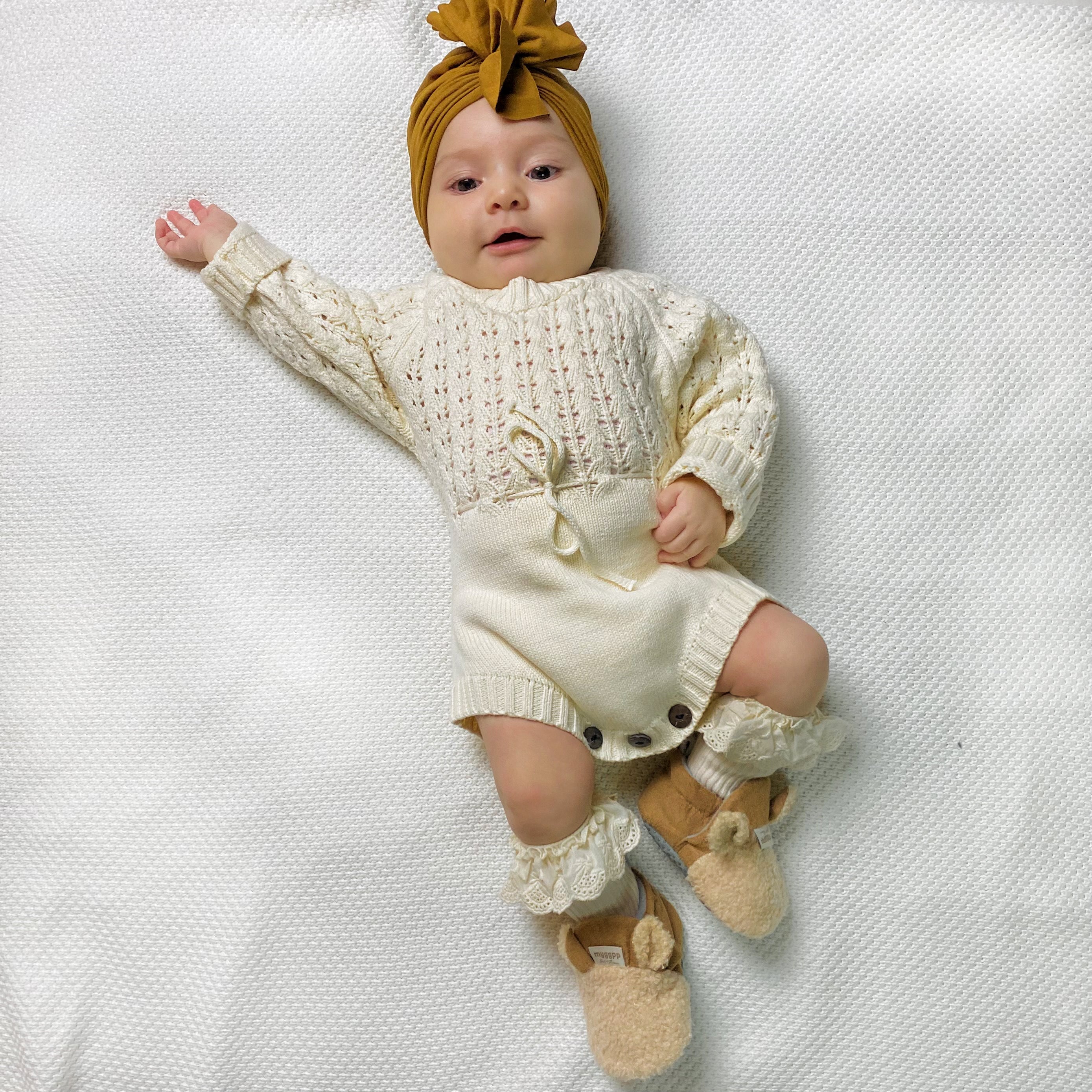 Pagliaccetto a maglia in bianco crema