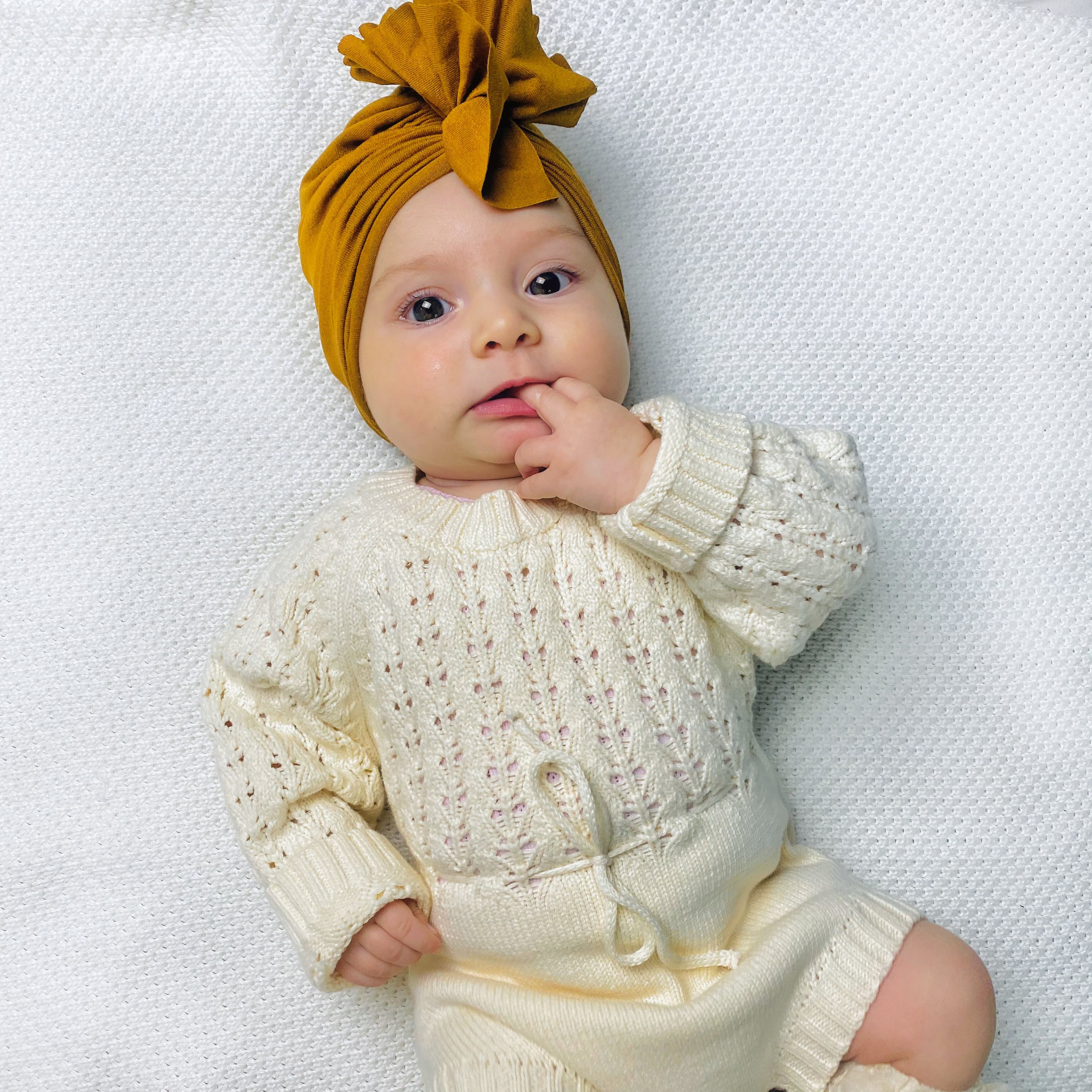 Pagliaccetto a maglia in bianco crema